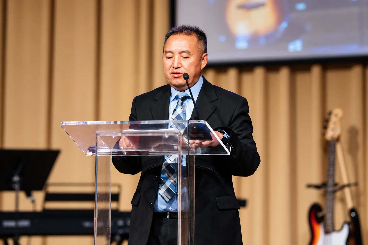A GHAC leader speaking from the church lectern
